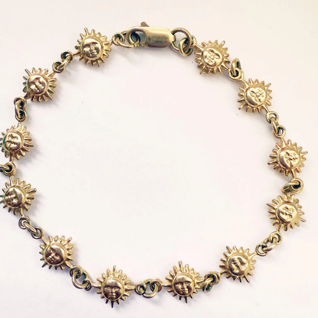 estate bracelet made of 14k gold with smiling sun links
