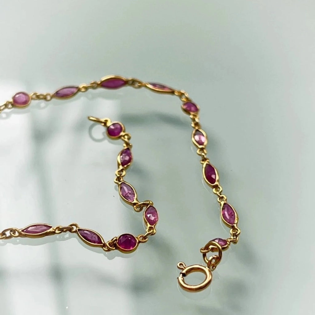 18k gold ruby station bracelet marquise stones